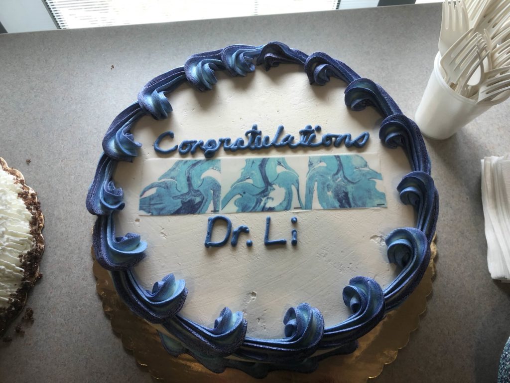 A blue and white decorated cake